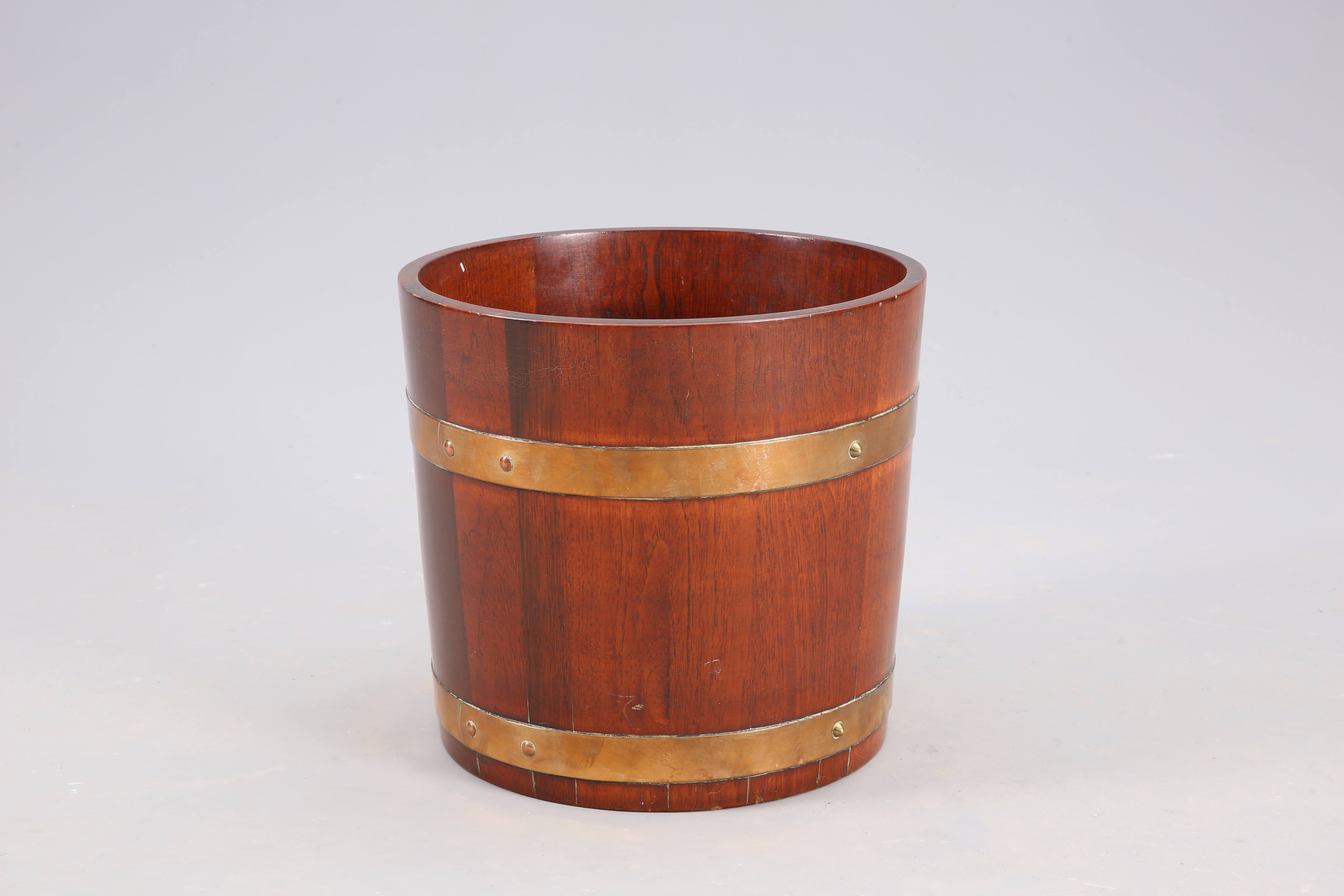 A BRASS-BOUND COOPERED TEAK BARREL-FORM BUCKET