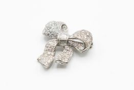 A DIAMOND SET BOW BROOCH