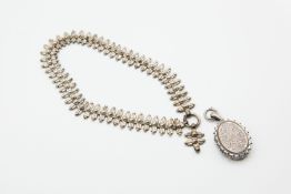 A VICTORIAN SILVER LOCKET ON HEAVY COLLAR