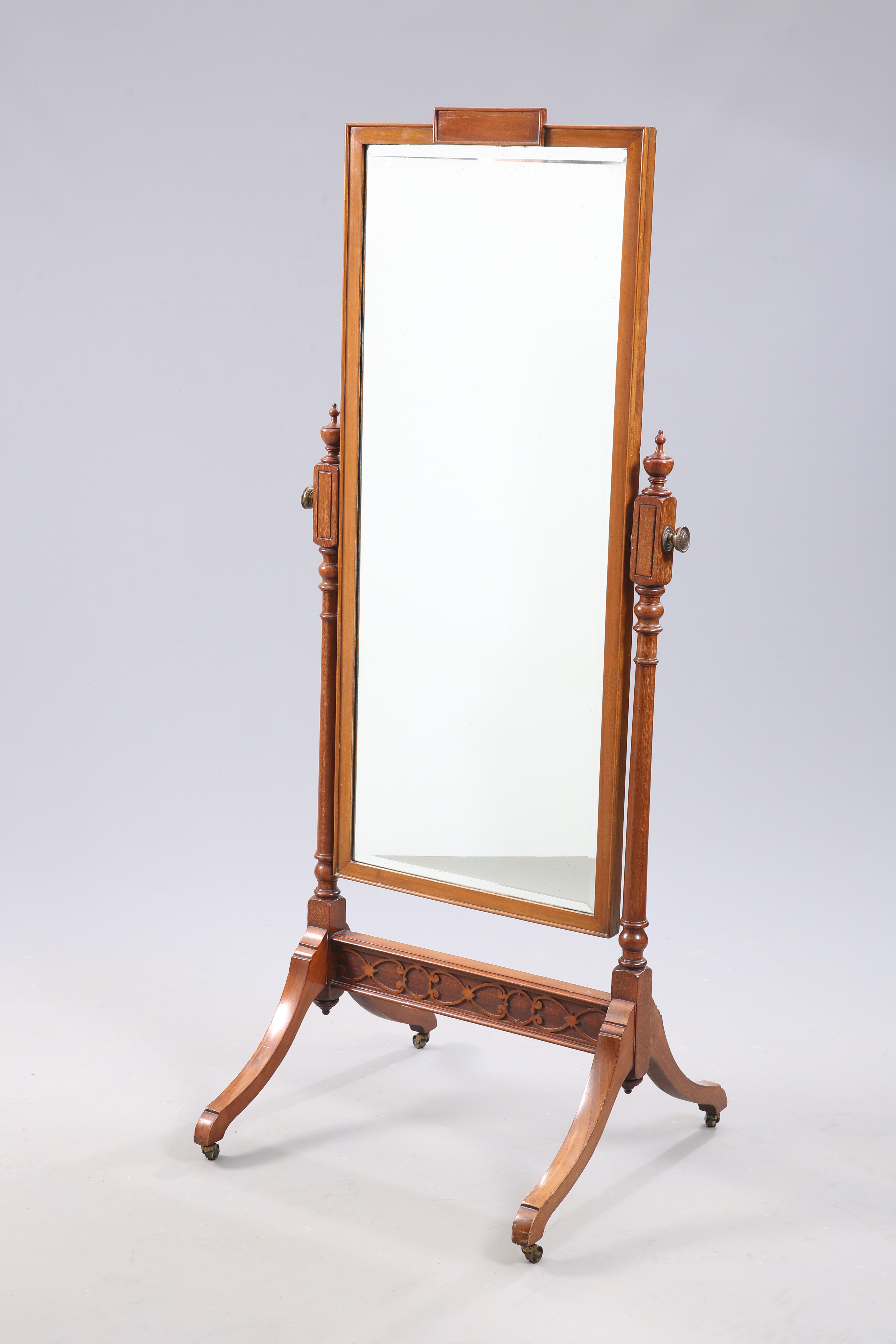 AN EDWARDIAN MAHOGANY CHEVAL MIRROR