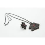 AN ITALIAN BLACK DIAMOND AND RUBY PENDANT AND MATCHING RING BY GAVELLO