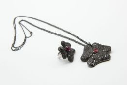 AN ITALIAN BLACK DIAMOND AND RUBY PENDANT AND MATCHING RING BY GAVELLO
