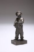 AN ENGLISH CAST-IRON FIGURE OF A NEWS BOY, "SPESHUL", c. 1930