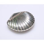 A LATE 19TH CENTURY SILVER-PLATED SHELL SHAPED VESTA CASE