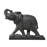 A LARGE CARVED STONE MODEL OF AN ELEPHANT, POSSIBLY INDIAN