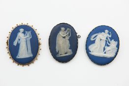 A TRIO OF WEDGWOOD BROOCHES
