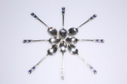 A SET OF EIGHT ART DECO SILVER AND ENAMEL COFFEE SPOONS