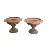 A PAIR OF VICTORIAN TERRACOTTA GARDEN PLANTERS OF URN FORM