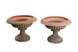 A PAIR OF VICTORIAN TERRACOTTA GARDEN PLANTERS OF URN FORM