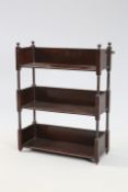 A SET OF REGENCY STYLE ROSEWOOD HANGING WALL SHELVES