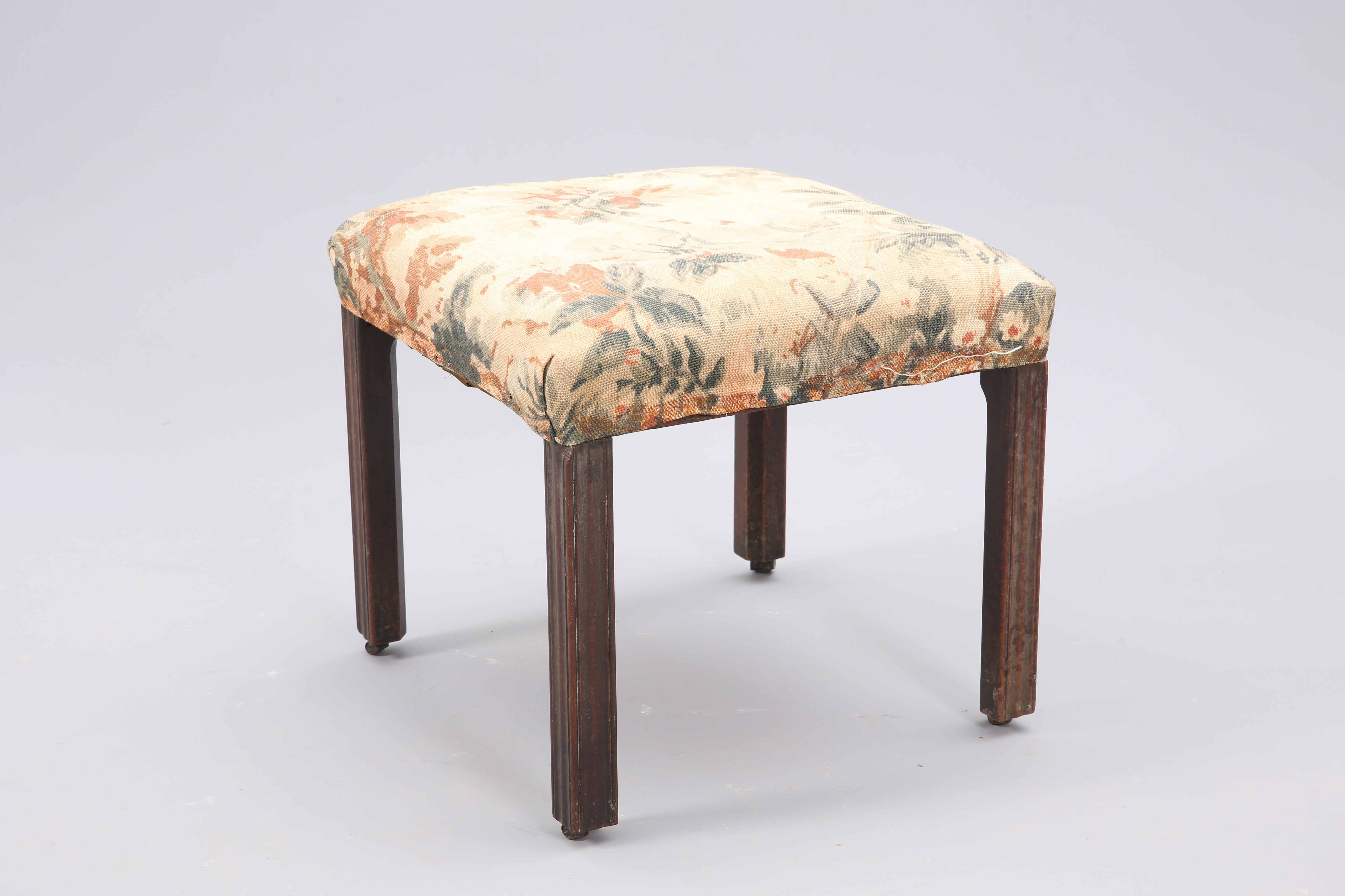 A GEORGIAN MAHOGANY AND UPHOLSTERED STOOL