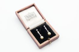 A PAIR OF NATURAL SALTWATER PEARL AND DIAMOND EARRINGS