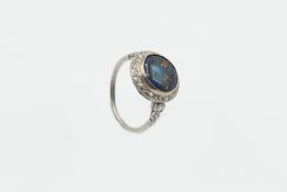 A BLACK OPAL AND DIAMOND RING