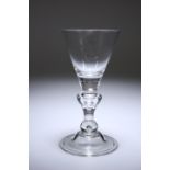 A HEAVY BALUSTER WINE GLASS, c. 1720