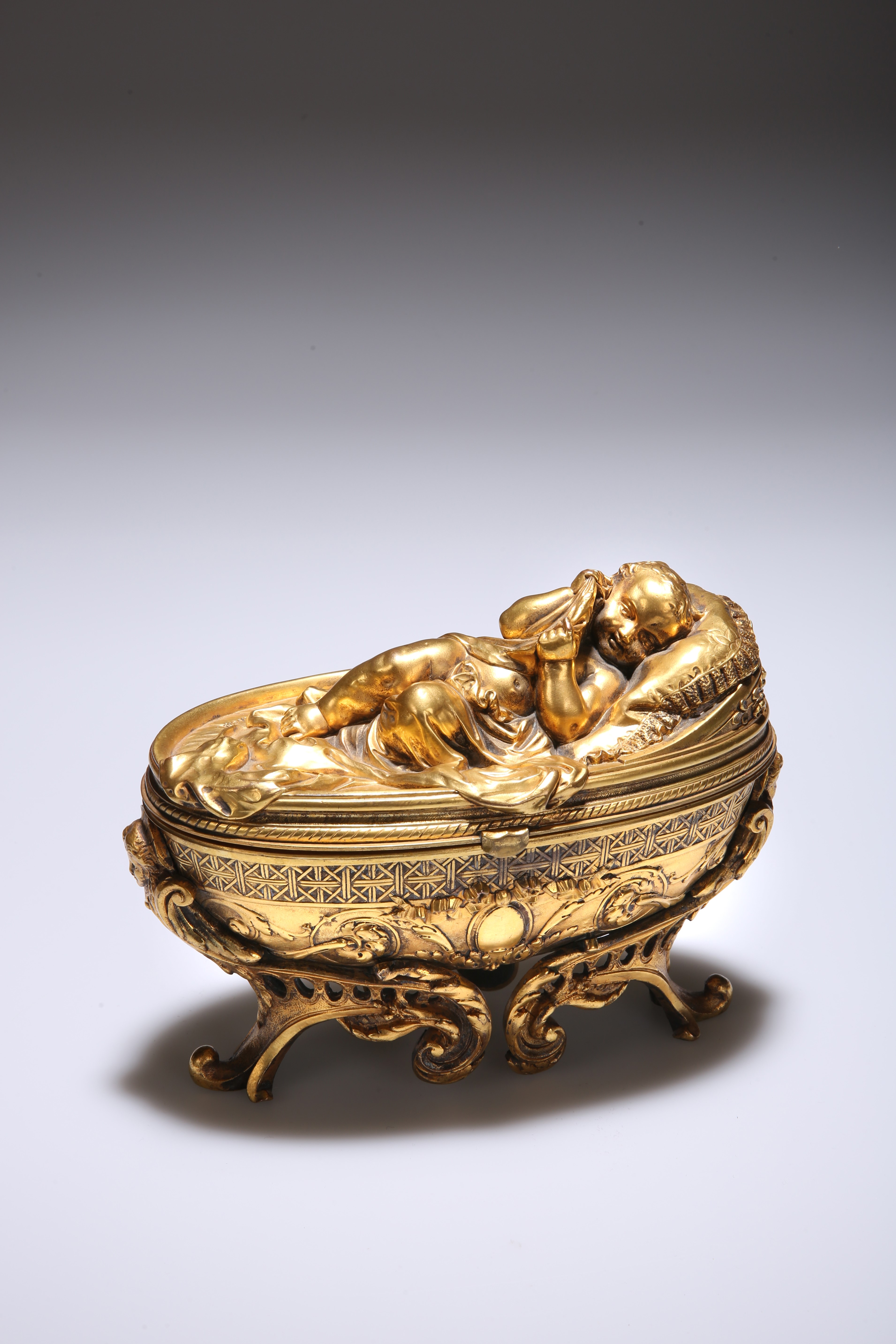 A 19TH CENTURY GILT-METAL JEWELLERY CASKET