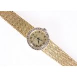 A BAUME & MERCIER GOLD AND DIAMOND WRIST WATCH