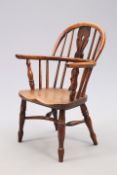 A 19TH CENTURY YEW WOOD CHILD'S WINDSOR ARMCHAIR