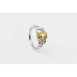 A YELLOW SAPPHIRE AND DIAMOND RING