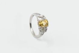 A YELLOW SAPPHIRE AND DIAMOND RING