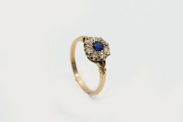 A SAPPHIRE AND DIAMOND CLUSTER RING