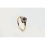 A SAPPHIRE AND DIAMOND CLUSTER RING