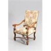 A LARGE 18TH CENTURY STYLE CONTINENTAL WALNUT AND UPHOLSTERED ARMCHAIR, 19TH CENTURY