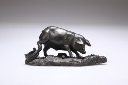 A BRONZE MODEL OF A PIG, INDISTINCTLY SIGNED