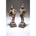 A PAIR OF TINTED SPELTER FIGURES OF NORSE WARRIORS