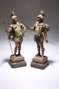 A PAIR OF TINTED SPELTER FIGURES OF NORSE WARRIORS