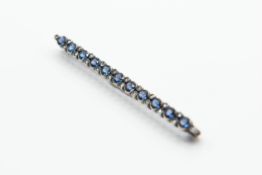 A DIAMOND AND SAPPHIRE BAR BROOCH