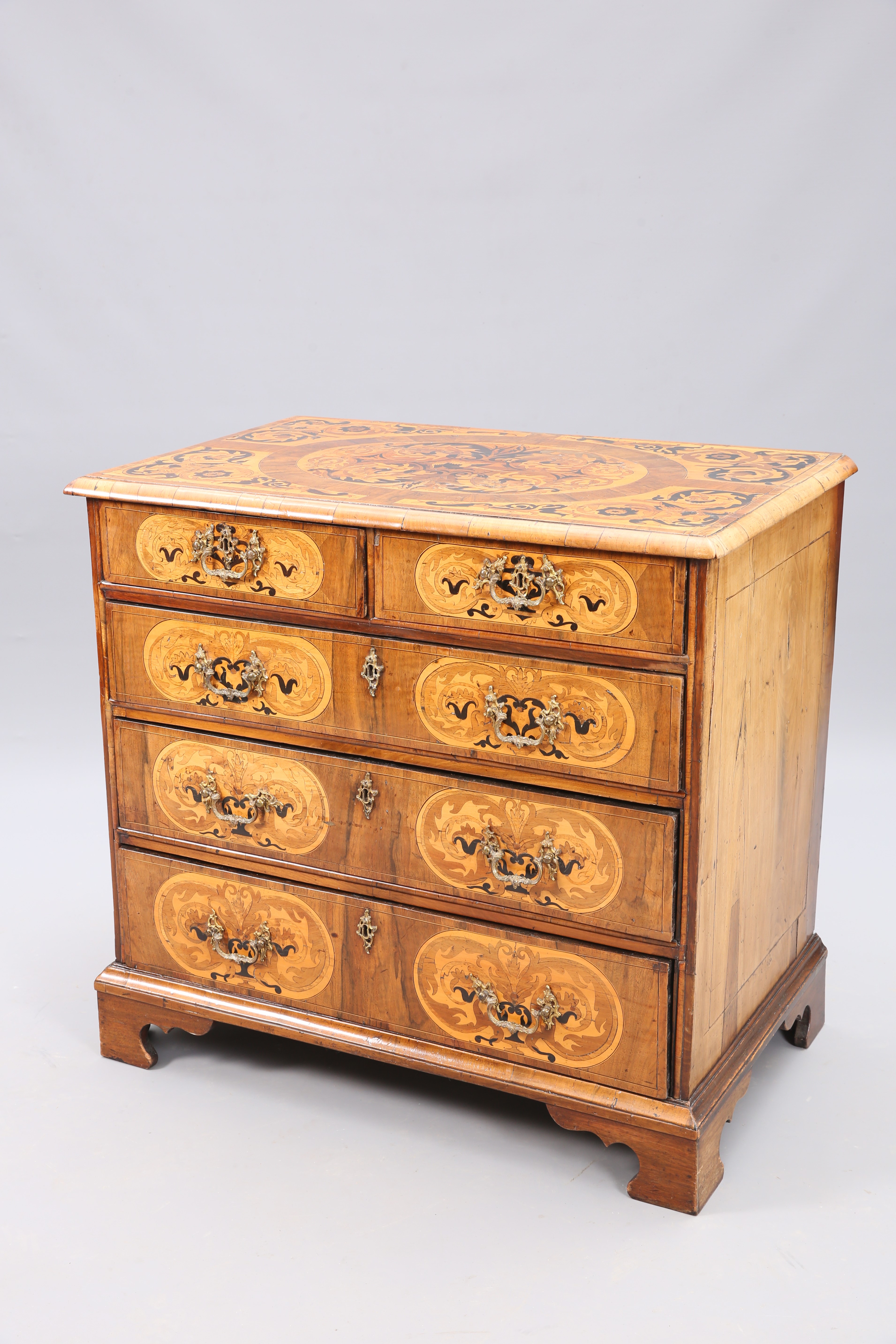 AN 18TH CENTURY MARQUETRY AND WALNUT COMMODE
