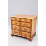 AN 18TH CENTURY MARQUETRY AND WALNUT COMMODE