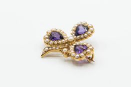 AN AMETHYST AND SEED PEARL BROOCH