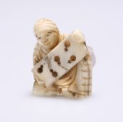 A JAPANESE CARVED IVORY NETSUKE, MEIJI PERIOD, CIRCA 1900