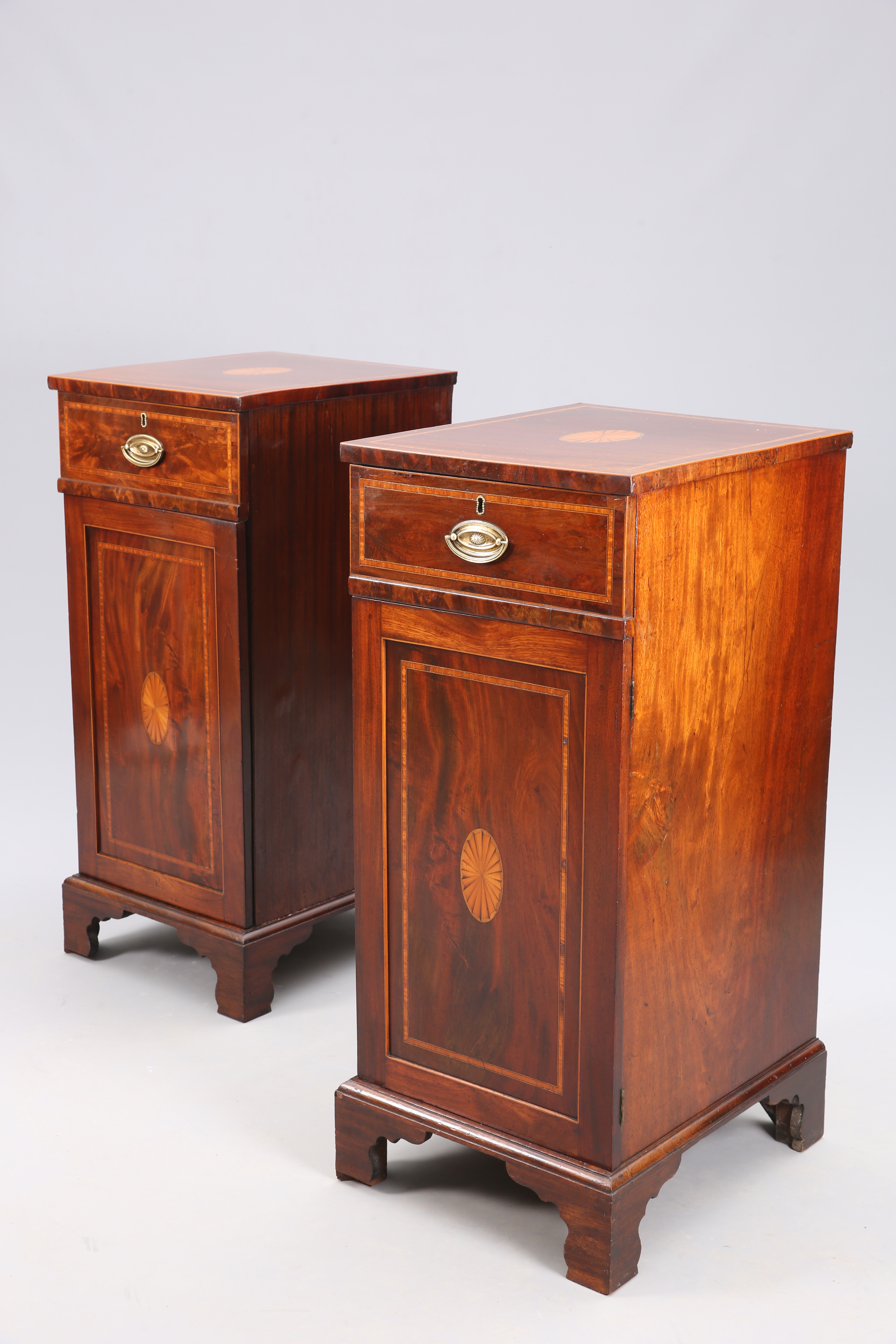 A PAIR OF GEORGE III STYLE INLAID MAHOGANY PEDESTAL CUPBOARDS
