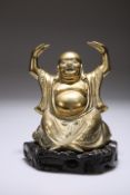 A CHINESE BRASS FIGURE OF A SEATED BUDDHA