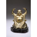 A CHINESE BRASS FIGURE OF A SEATED BUDDHA