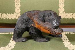 A BLACK FOREST CARVING OF A BEAR