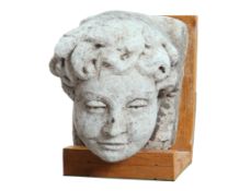 A CARVED LIMESTONE CORBEL