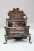 A VICTORIAN CAST IRON FIRE BASKET