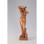 A FINE AND LARGE CARVED OAK FIGURE OF A SCANTILY CLAD MAIDEN