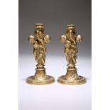 A SUBSTANTIAL PAIR OF GILT-METAL FIGURAL CANDLESTICKS, IN THE NAPOLEON III TASTE