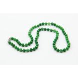 A JADEITE BEAD NECKLACE