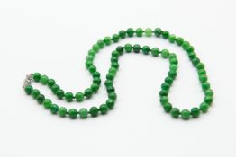 A JADEITE BEAD NECKLACE