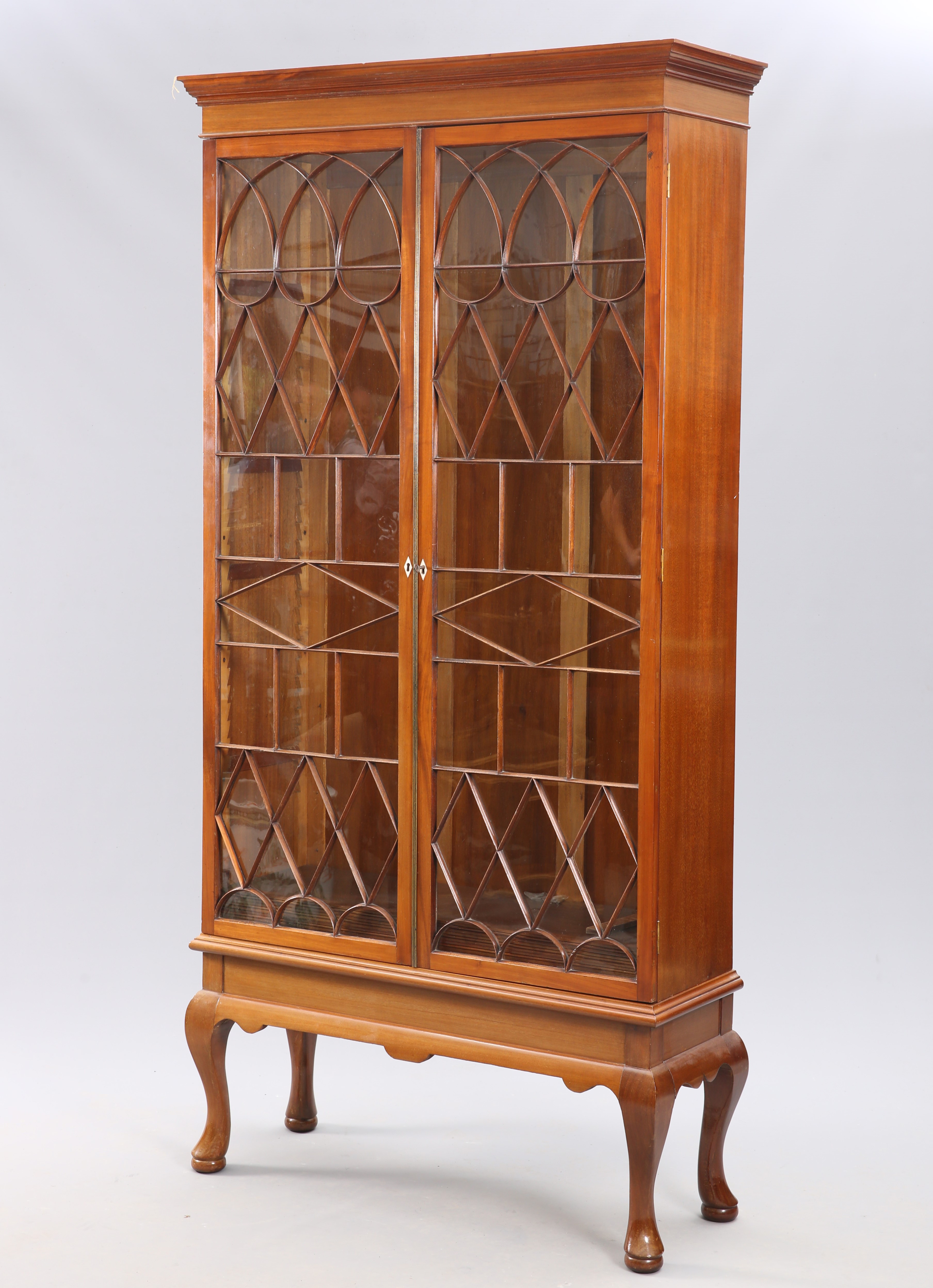 A MAHOGANY ASTRAGAL GLAZED BOOKCASE ON STAND, IN GEORGE III STYLE,