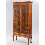 A MAHOGANY ASTRAGAL GLAZED BOOKCASE ON STAND, IN GEORGE III STYLE,