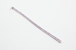 AN 18CT WHITE GOLD AND PINK ZIRCON LINE BRACELET