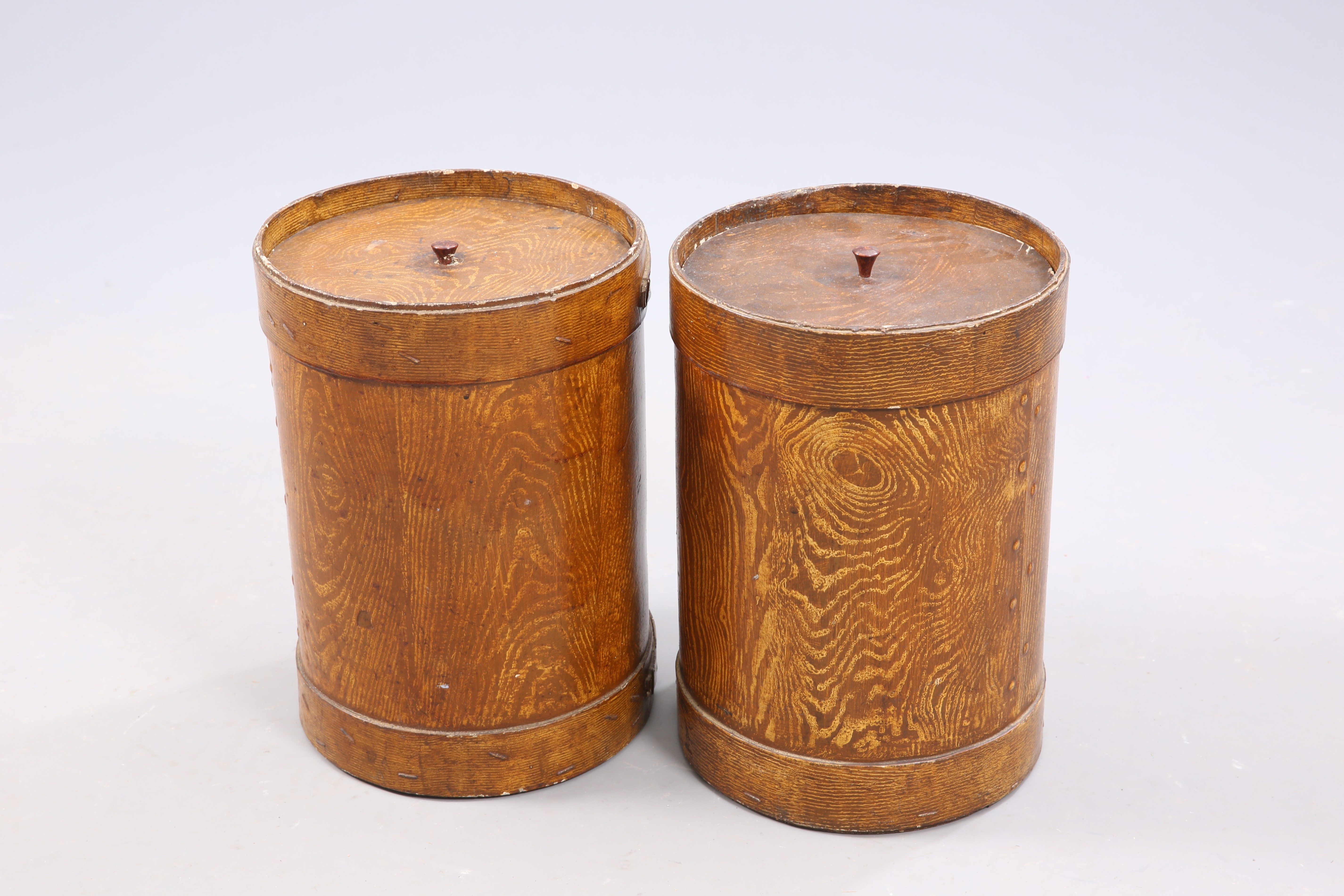 A PAIR OF VICTORIAN GRAIN PAINTED WOODEN LIDDED BARRELS