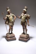 A PAIR OF TINTED SPELTER FIGURES OF NORSE WARRIORS