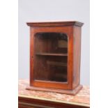 A SMALL MAHOGANY GLAZED CABINET